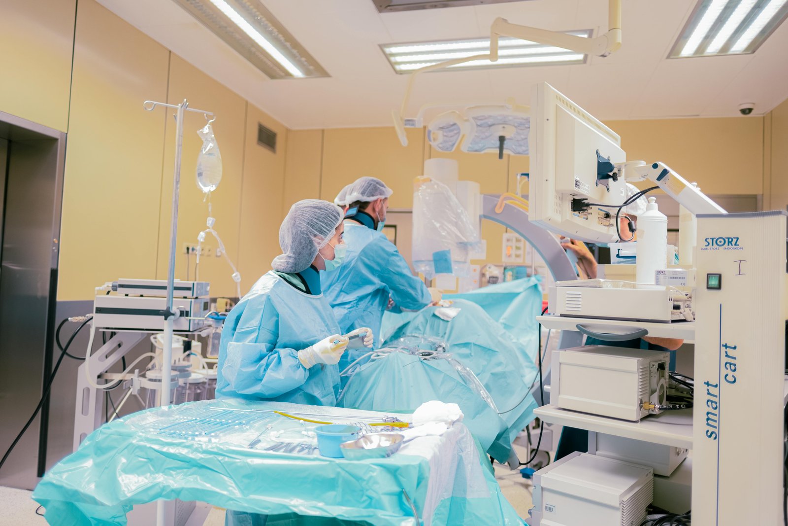 Surgical team in Baku, Azerbaijan operating room with advanced equipment and sterile environment.